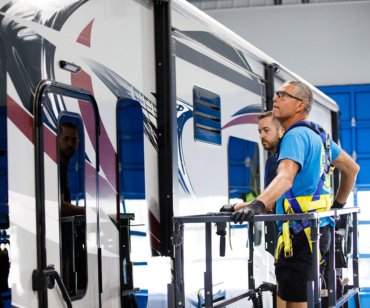 Brad and Jerod analyzing a Scissor Lift on an RV